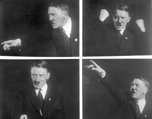 Hitler practicing speaking poses for the camera. Source: Wikipedia; By Bundesarchiv, Bild 102-10460 / Hoffmann, Heinrich / CC-BY-SA 3.0, CC BY-SA 3.0 de, 